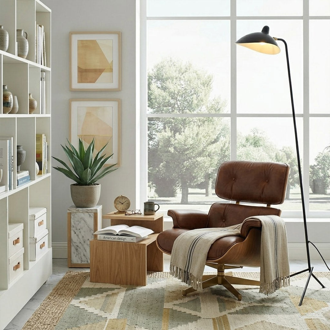 Vega mid century floor lamp next to reading armchair modern living room matte black sculptural statement white neutral interior