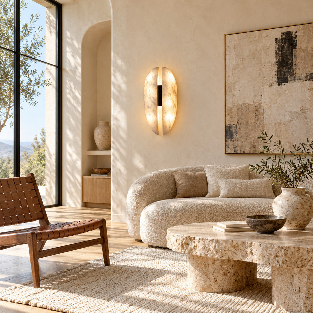 Velo alabaster wall sconce next to a sofa in a modern living room