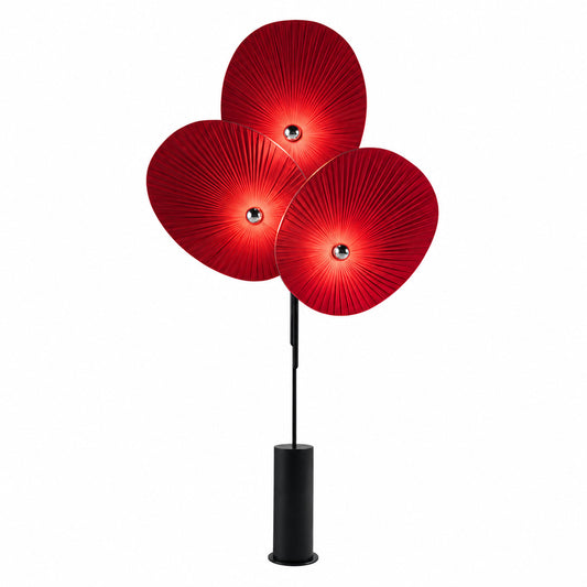 Ventaglio floor lamp with postmodern fan-shaped pleated fabric shades glowing warm in a living room