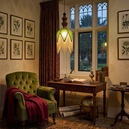 Verde green tassel pendant light beside bed warm glow boho bedroom interior with plants