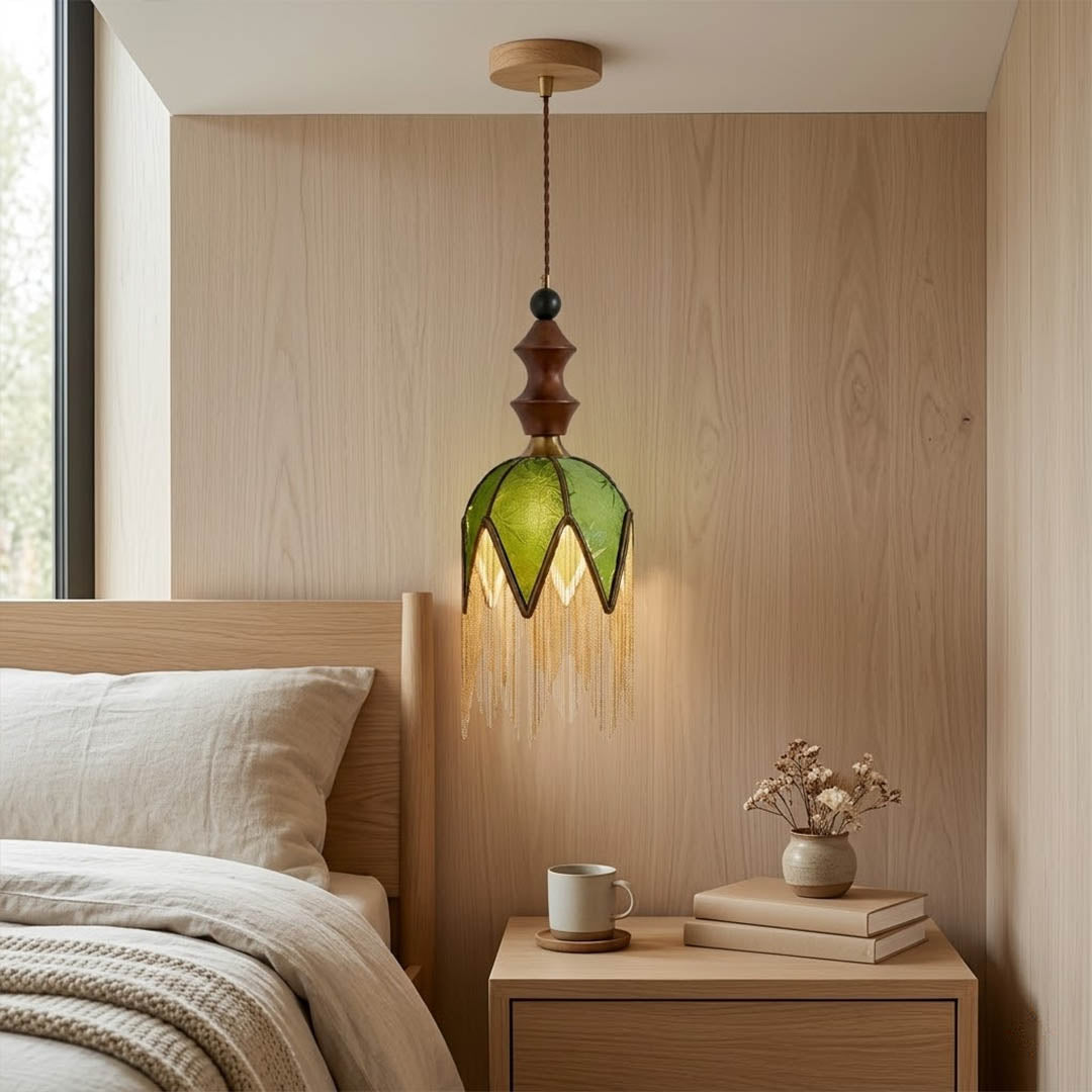 Verde green tassel pendant light beside bed warm glow boho bedroom interior with plants