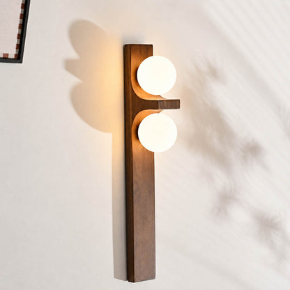 Verena double wall sconce illuminated glowing white glass globe soft warm diffused light detail close up cozy