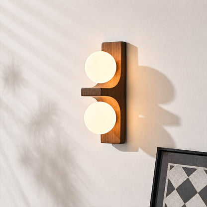 Verena double wall sconce illuminated glowing white glass globe soft warm diffused light detail close up cozy