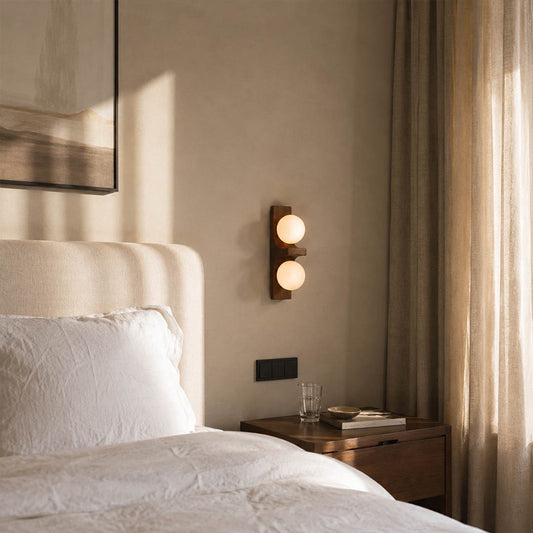 Verena double wall sconce bedroom bedside bed frame wood glass globe warm glow natural American home lifestyle interior styled