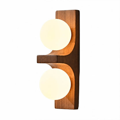 Verena double wall sconce short walnut dark wood two white glass globes compact white background front view