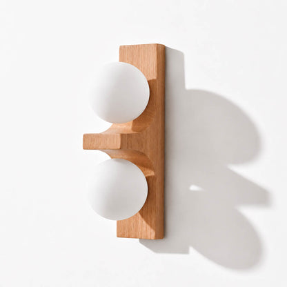 Verena double wall sconce short oak light wood two white glass globes compact white background front view