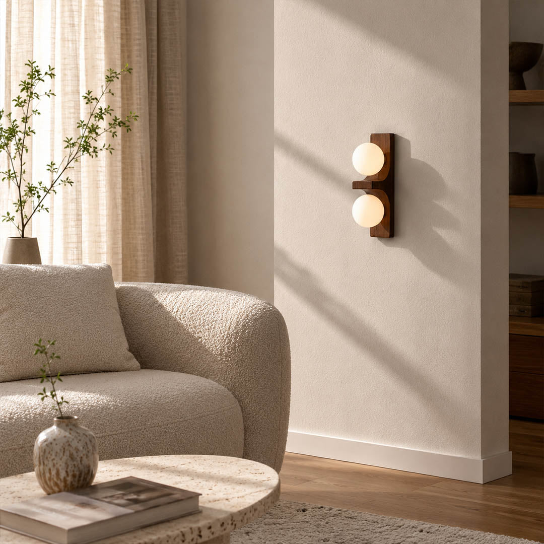 Verena double wall sconce living room sofa side wood glass globe warm ambient natural American home lifestyle interior styled