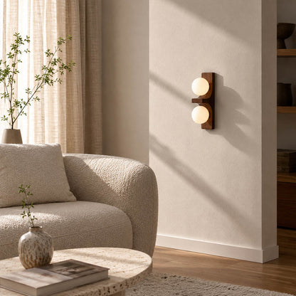 Verena double wall sconce living room sofa side wood glass globe warm ambient natural American home lifestyle interior styled