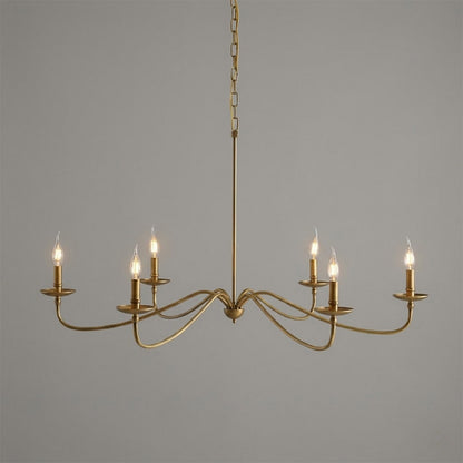 Versailles brass candle chandelier above dining table warm vintage light traditional interior