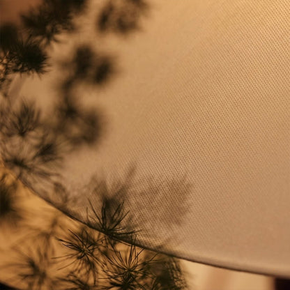 Vienne French vintage table lamp on nightstand bedroom warm fabric shade glow lifestyle interior