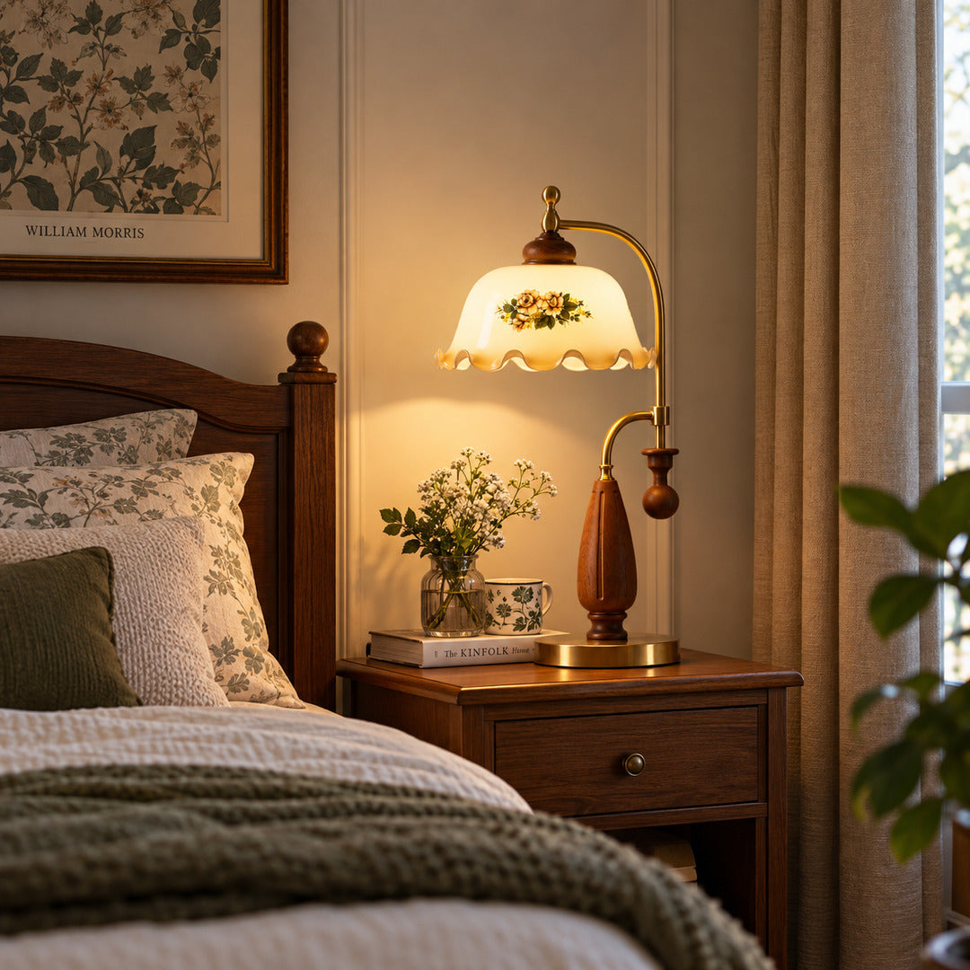 Volant vintage table lamp casting a warm glow on a bedroom nightstand for bedside reading