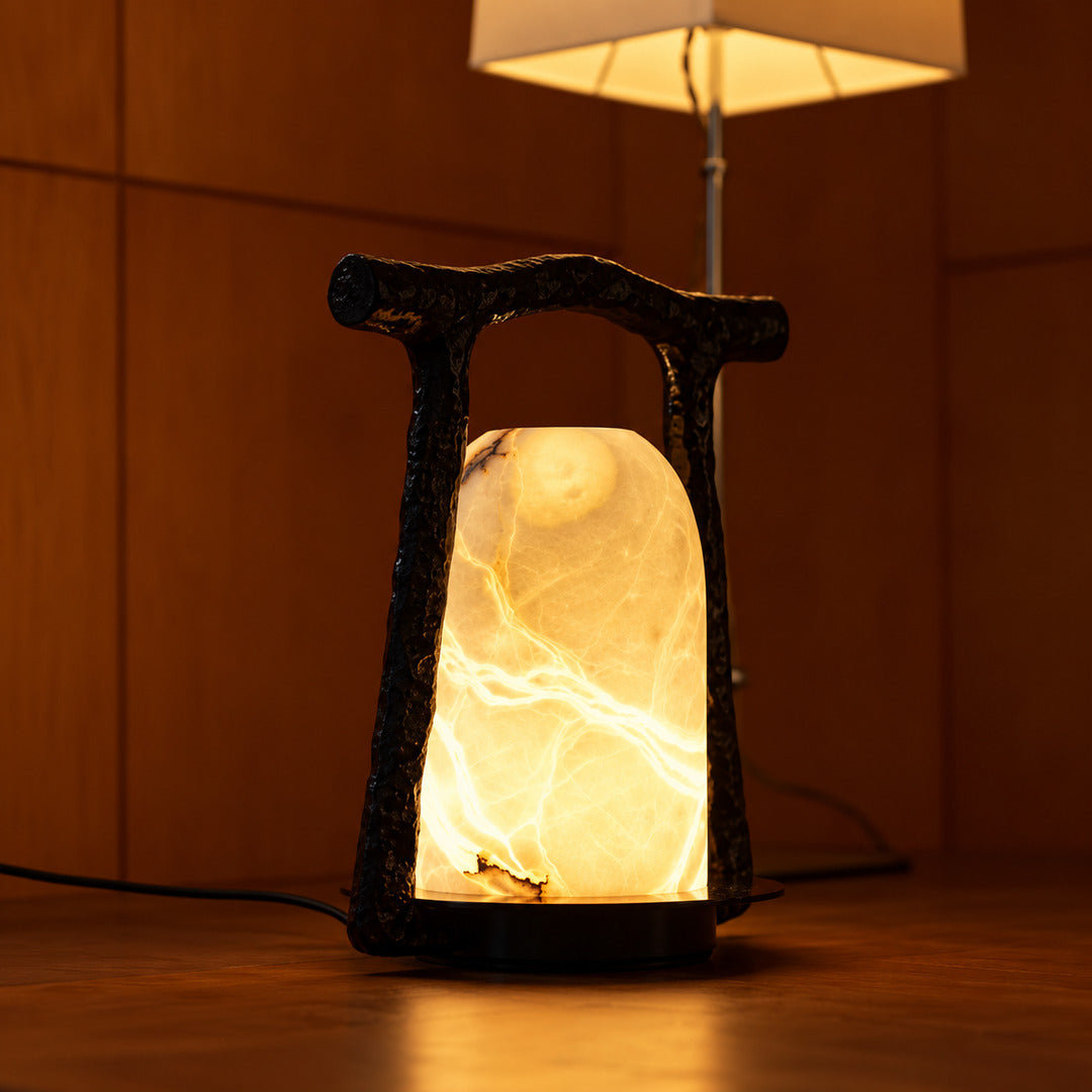Volta alabaster table lamp displayed in a design boutique