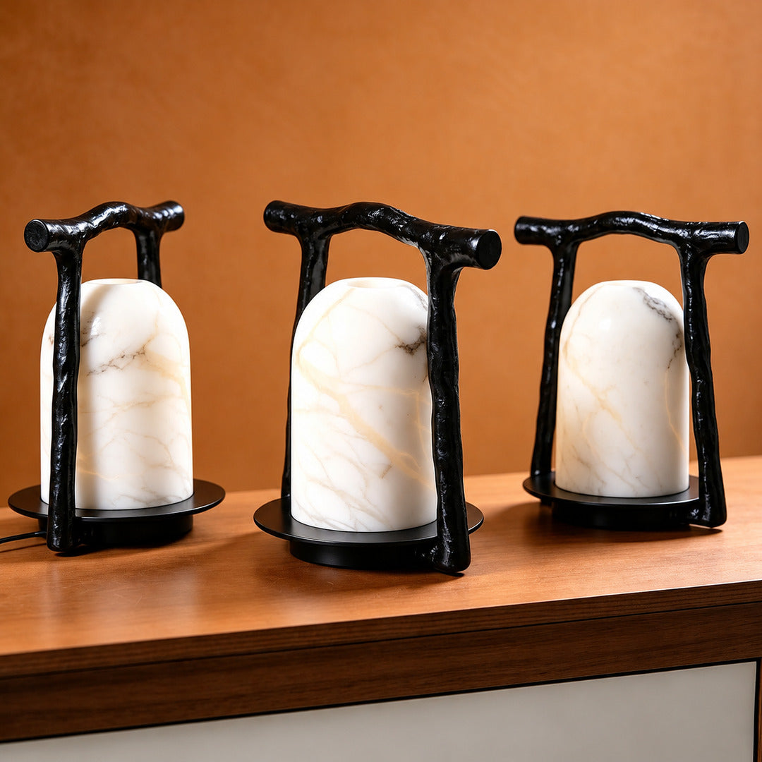 Close-up of natural veining glowing through the alabaster dome of the Volta table lamp