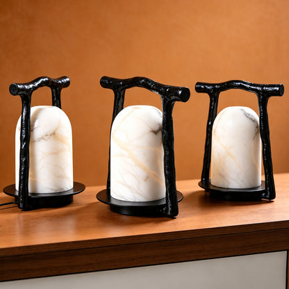 Close-up of natural veining glowing through the alabaster dome of the Volta table lamp