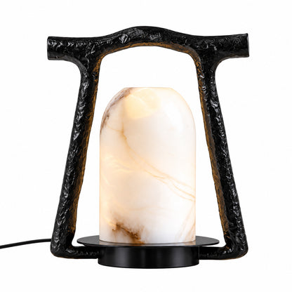 Volta sculptural table lamp with arch-shaped black frame and white alabaster dome on a white background