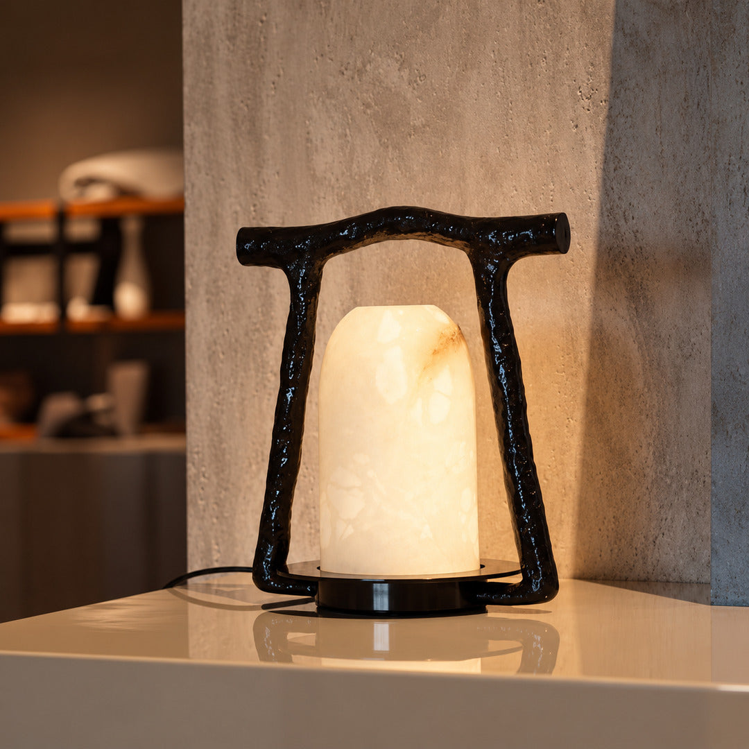 Volta alabaster table lamp as a sculptural accent on an entryway console