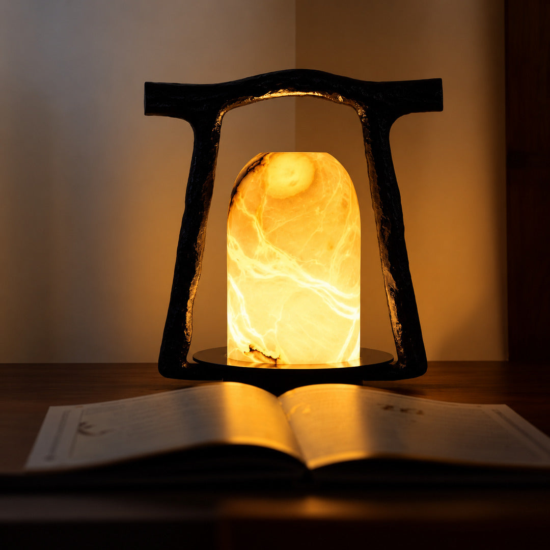 Volta alabaster table lamp adding ambient light to a home office desk
