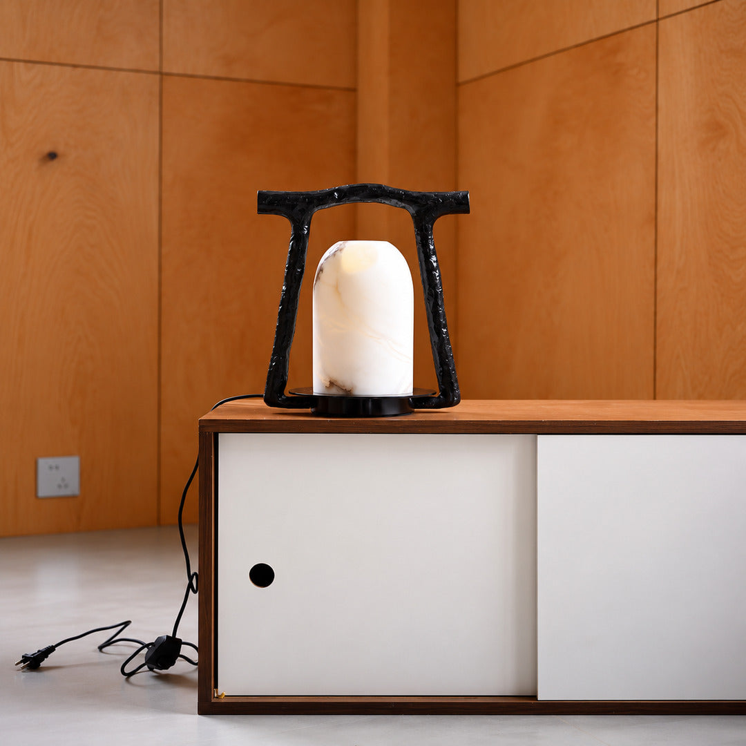 Volta alabaster table lamp as a sculptural accent on an entryway console
