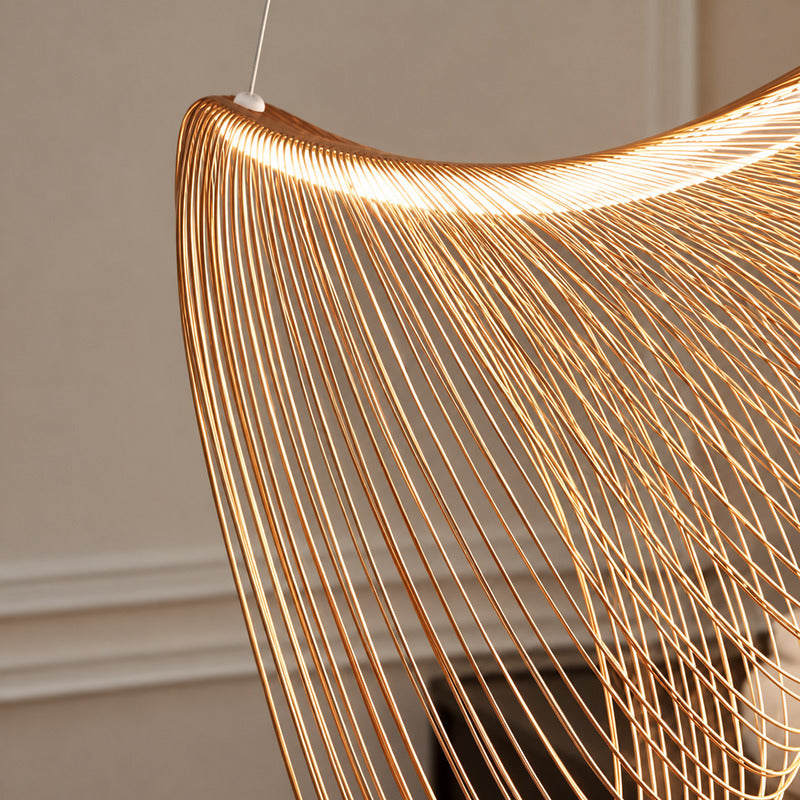 Soft diffused warm glow from the acrylic diffuser inside the Voluta wood pendant light