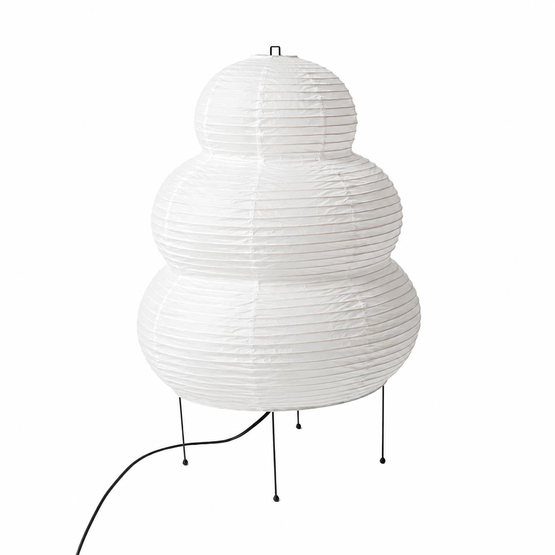 The organic textured silhouette and black wire legs of an unlit Washi Paper 25N Table Lamp on a white background by Stuber Lighting.