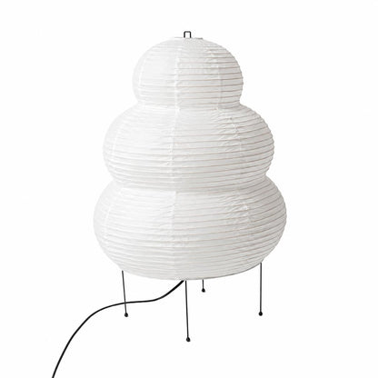 The organic textured silhouette and black wire legs of an unlit Washi Paper 25N Table Lamp on a white background by Stuber Lighting.
