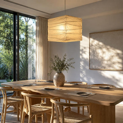 Minimalist Washi Paper 33X 45X Pendant Light centered over a wooden dining table in a sunlit room by Stuber Lighting.