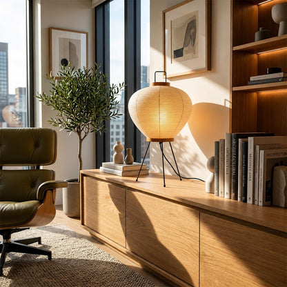 Sculptural Washi Paper 3A Table Lamp on a long wooden credenza in a sunlit apartment with scenic city views by Stuber Lighting.