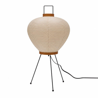 The organic structured silhouette and top handle of an unlit textured Washi Paper 3A Table Lamp on a white background by Stuber Lighting.