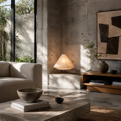 Sunlit living room corner featuring the 5X washi paper pyramid table lamp on a rustic wooden stand