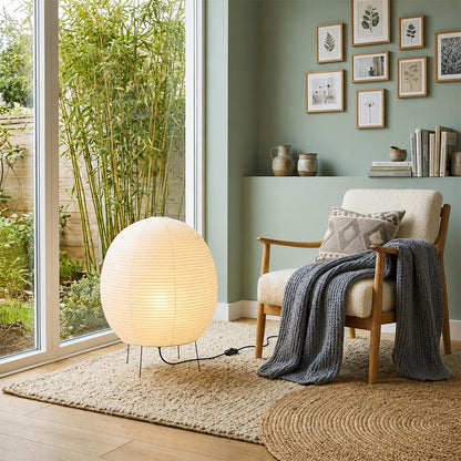 Cozy reading nook by the window featuring a round Washi paper table lamp - stuberlighting