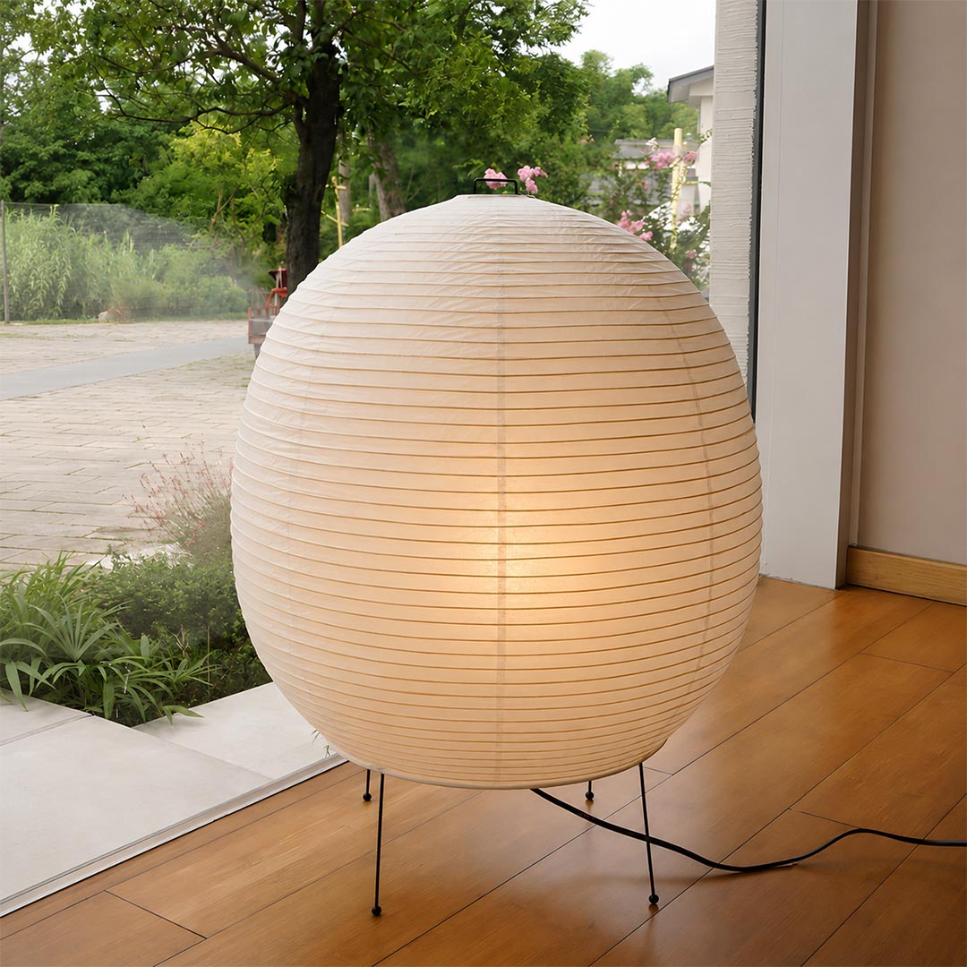 Spherical Washi paper lantern lamp glowing on a minimalist wooden floor - stuberlighting