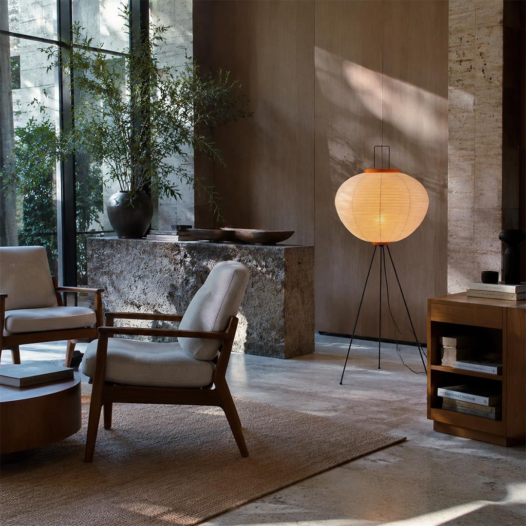 Washi paper tripod floor lamp styled in a bright minimalist living room with wooden furniture