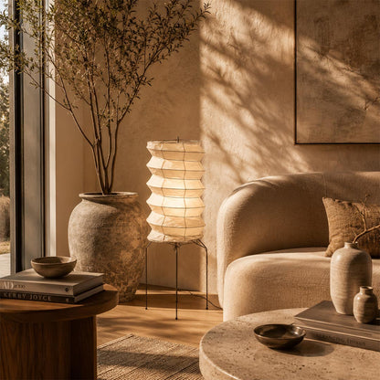Tall Washi Paper UF2-31N Floor Table Lamp placed in a sun-drenched Japandi living room with a large potted tree by Stuber Lighting.