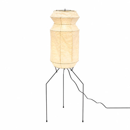 Studio shot of the illuminated Washi Paper UF3-L6 Tripod Floor Lamp against a white backdrop by Stuber Lighting.