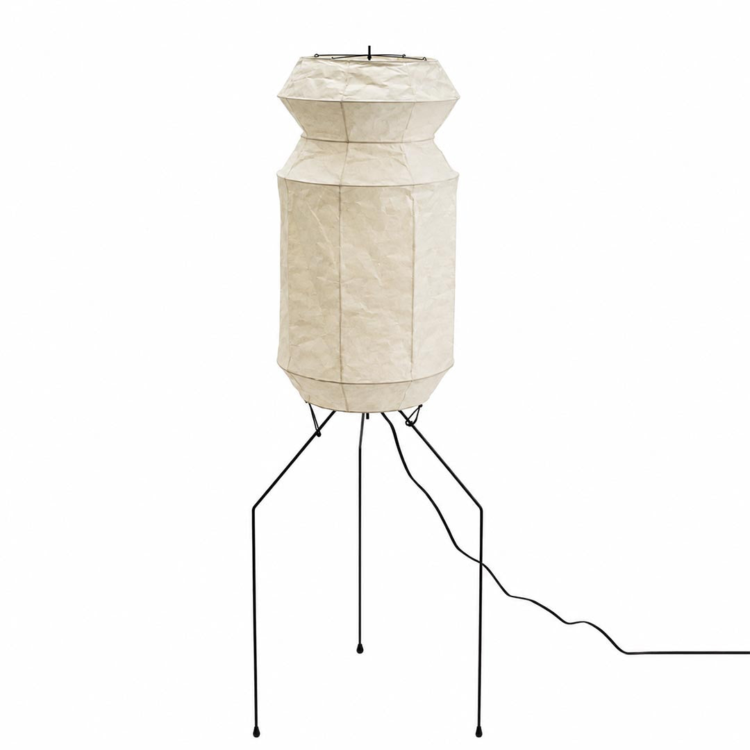 Detailed look of the unlit textured paper shade and slim tripod stand of a Washi Paper UF3-L6 Floor Lamp by Stuber Lighting.