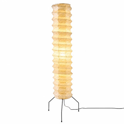 Studio portrait of an illuminated tall Washi Paper UF4-31N Floor Lamp with a glowing warm amber shade by Stuber Lighting.