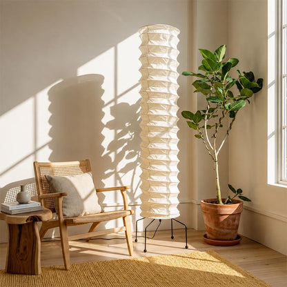 esthetic Washi Paper UF4-31N Ribbed Lantern Floor Lamp styled in a sun-drenched corner with a fiddle-leaf fig tree by Stuber Lighting.