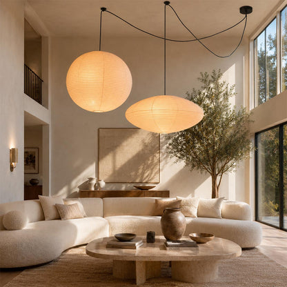 Dramatic 2-light Washi Paper Whimsy Pendant Light hanging in a luxurious high-ceiling Wabi-Sabi living room by Stuber Lighting.