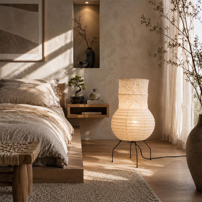 Aesthetic Washi Paper Zara Lantern Lamp used as a bedside nightlight in a minimalist Japandi bedroom by Stuber Lighting.