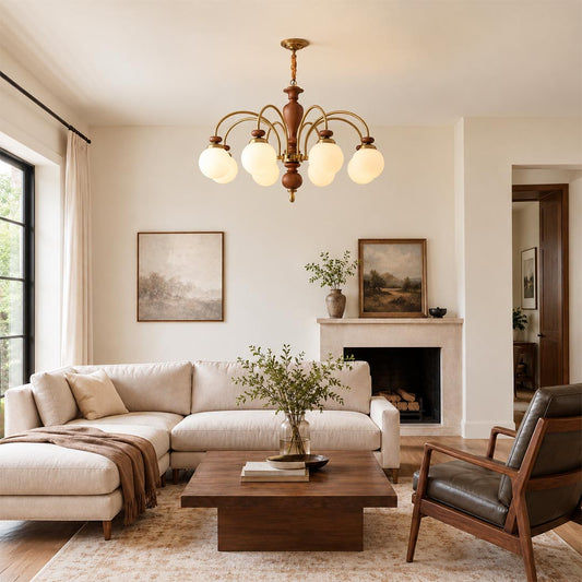 Windsor classic walnut chandelier hanging in a warm luxury living room with fireplace and wooden coffee table