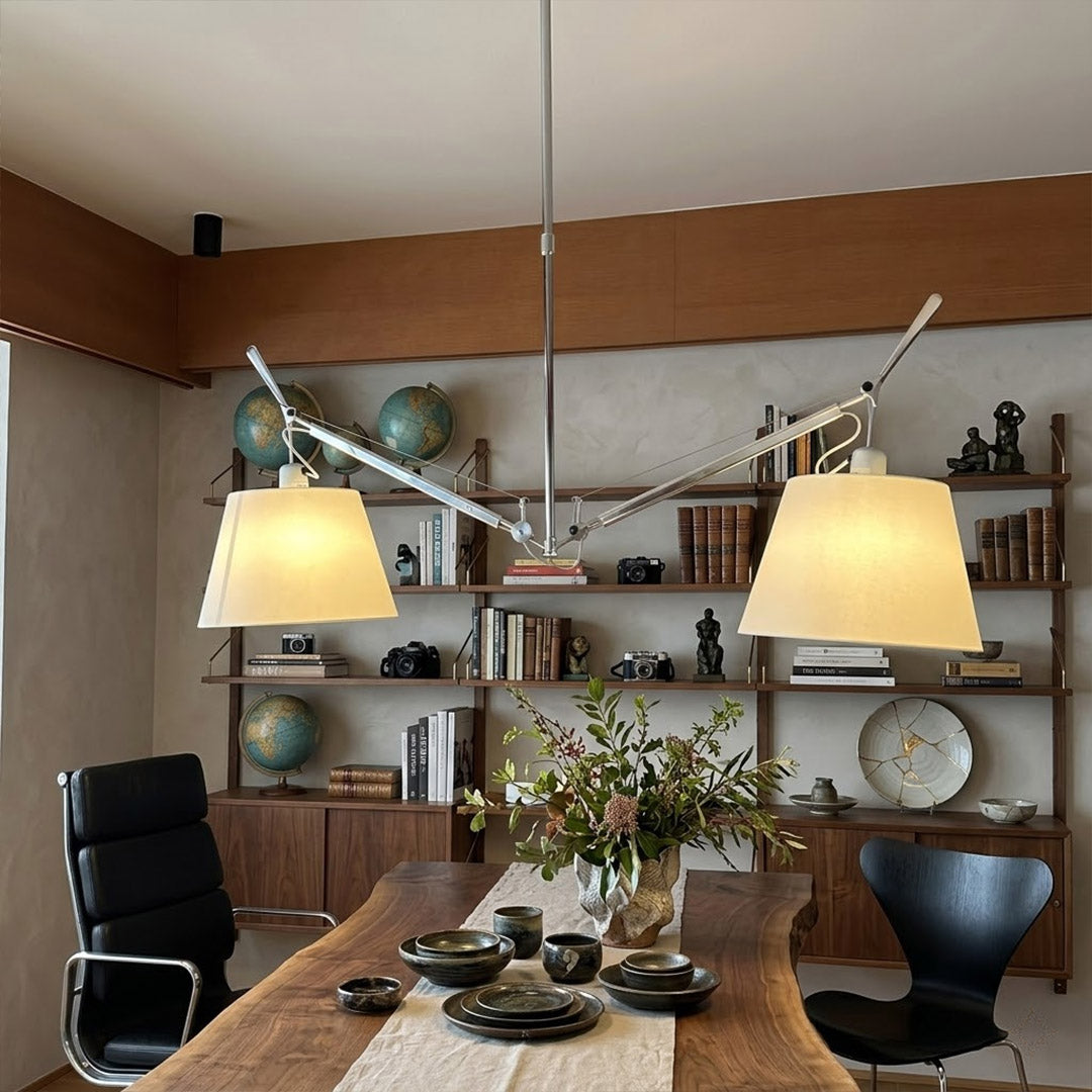 Wren swing arm pendant in modern library study room parchment paper warm amber glow vintage filament bulbs leather chair