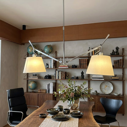 Wren swing arm pendant in modern library study room parchment paper warm amber glow vintage filament bulbs leather chair