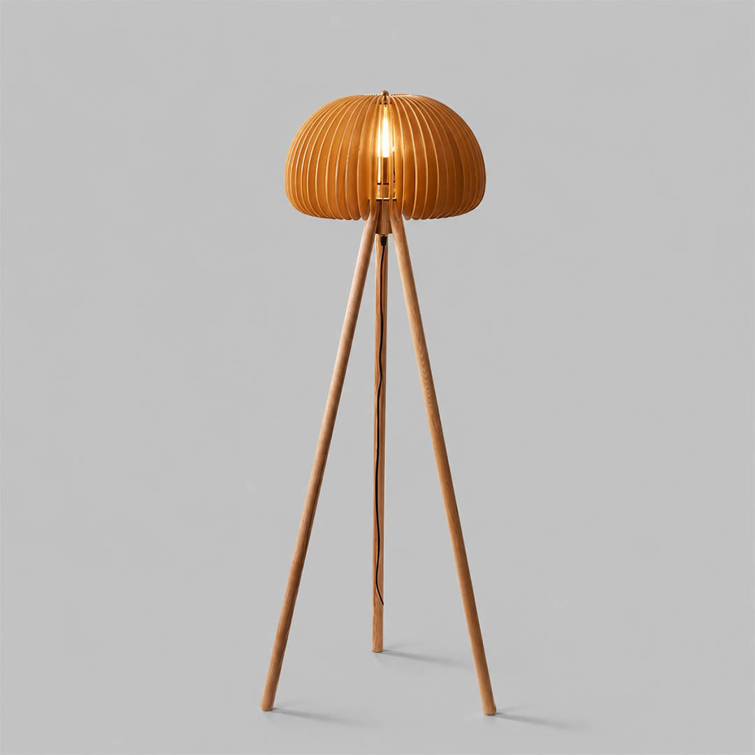 Zucca wood slat floor lamp illuminated warm glow through natural wood slats pumpkin shade tripod rustic cozy white background front view