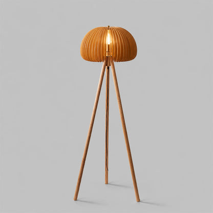 Zucca wood slat floor lamp illuminated warm glow through natural wood slats pumpkin shade tripod rustic cozy white background front view