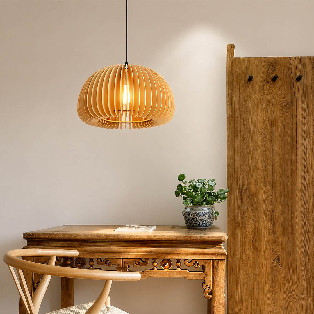 Zucca wood slat pendant light single over round dining table natural wood slat shade warm atmospheric glow rustic American home lifestyle interior
